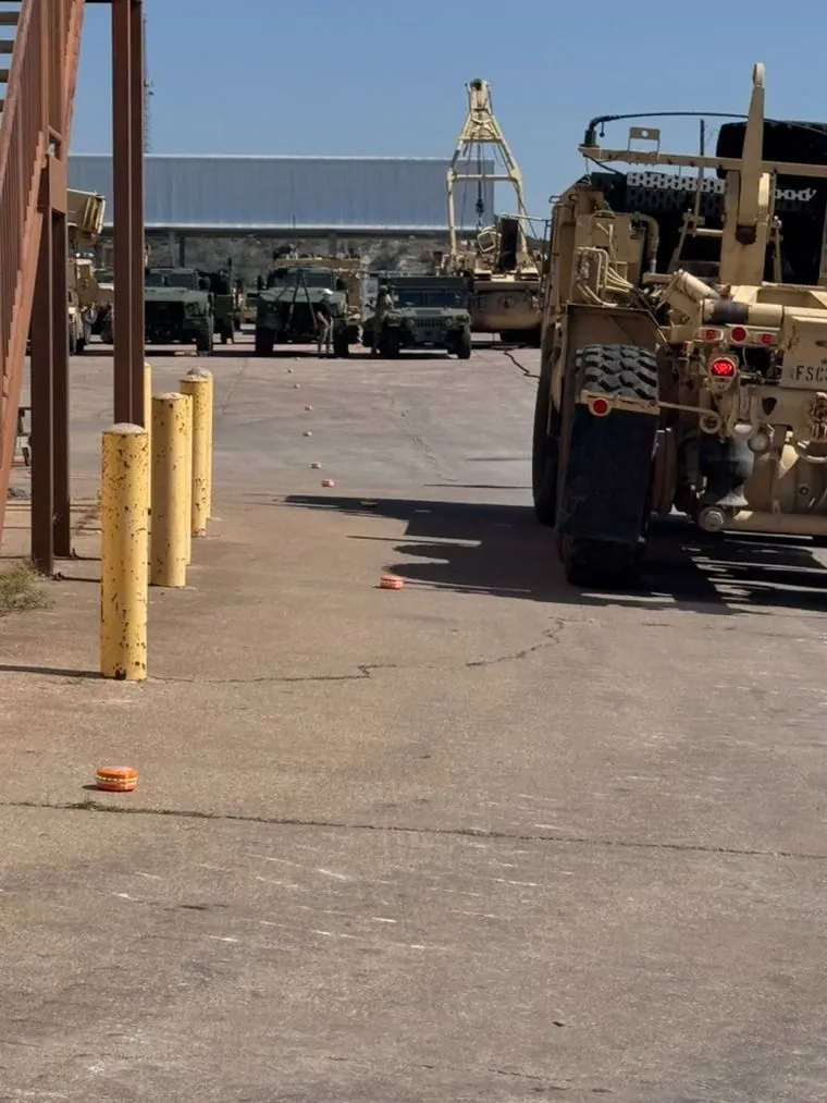 BreachON markers along a lane at a motor pool in daylight