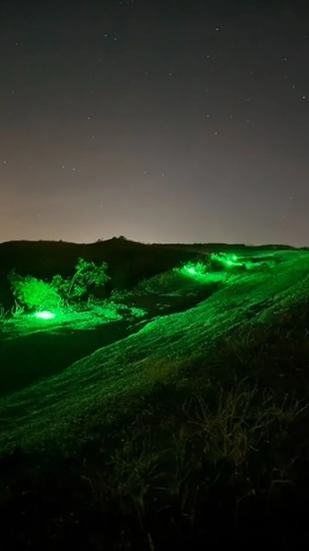 BreachON markers glowing across terrain at night